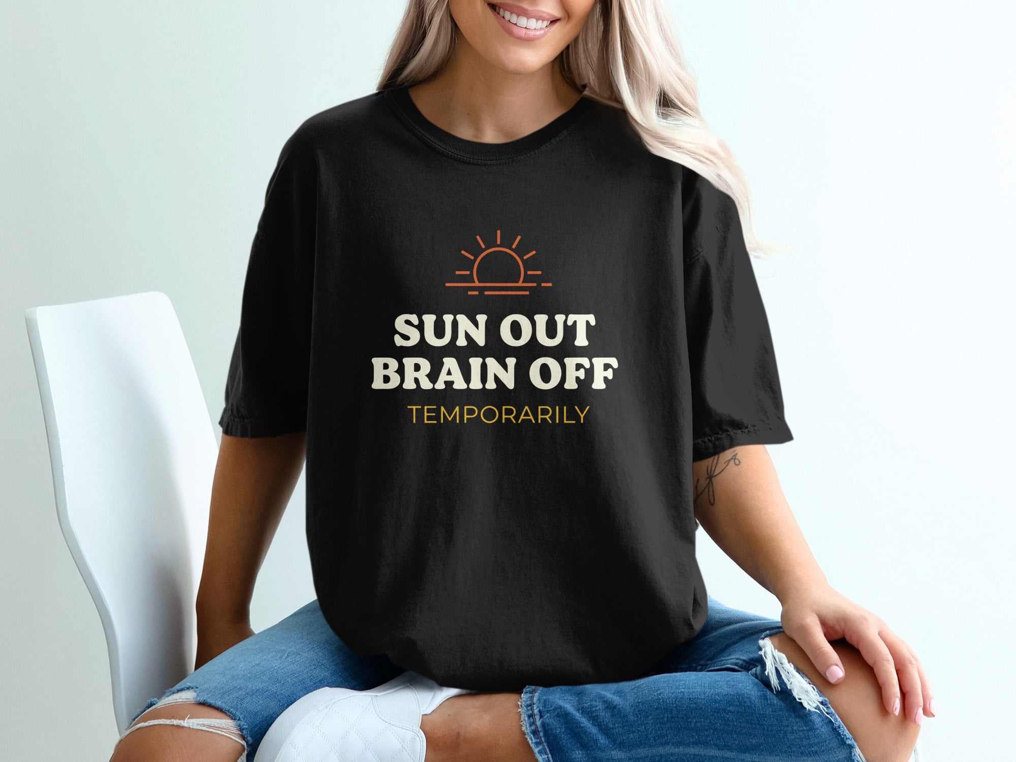 Black t-shirt with "SUN OUT BRAIN OFF TEMPORARILY" text and a sun graphic.