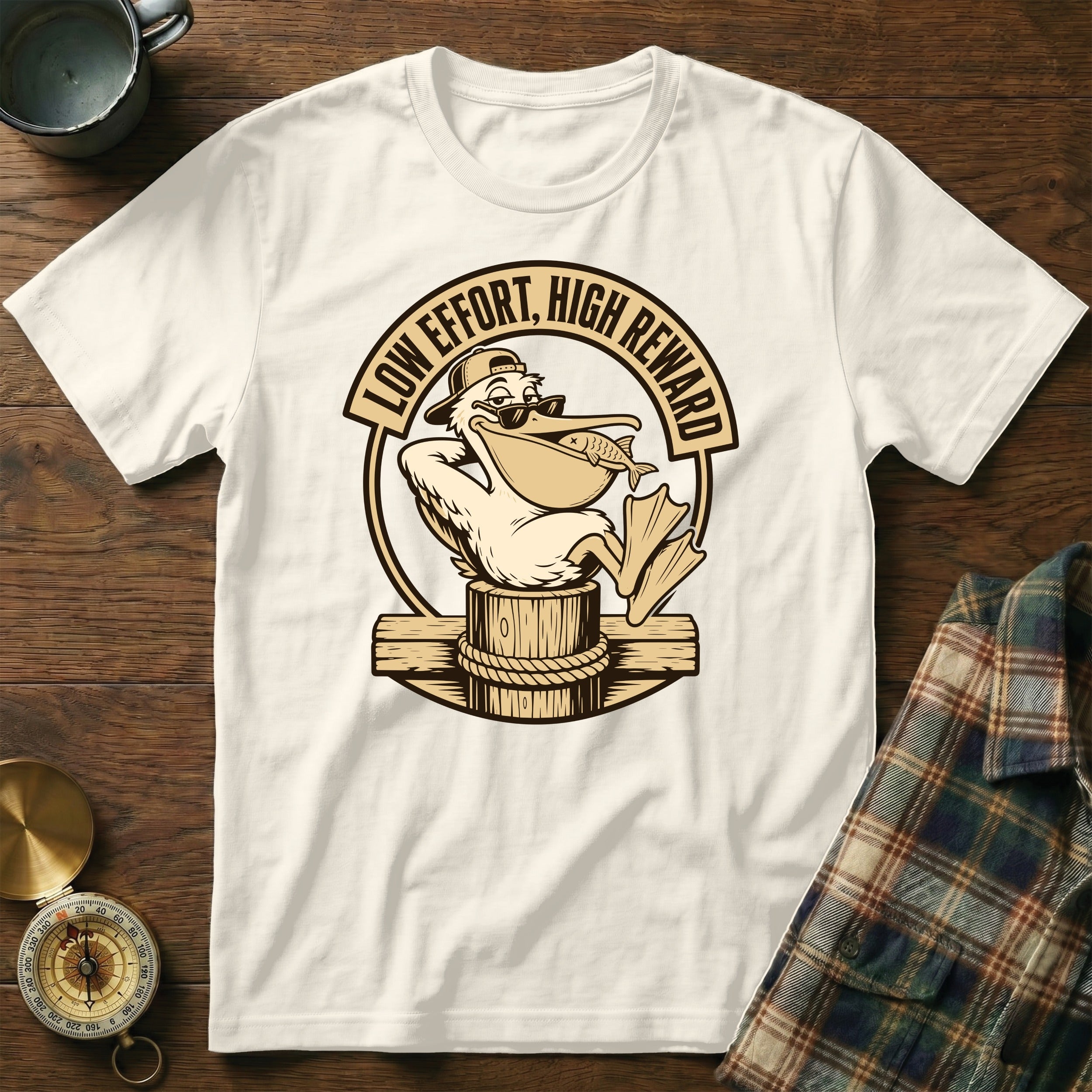 Cream t-shirt with a pelican graphic and text "LOW EFFORT, HIGH REWARD".
