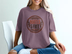 T-shirt with circular "ROOTED & FREE" graphic and nature motifs.