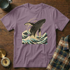 Purple t-shirt with breaching whale and ocean waves graphic.