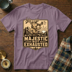 Purple t-shirt features a deer blowing a horn with text "MAJESTIC BUT EXHAUSTED".