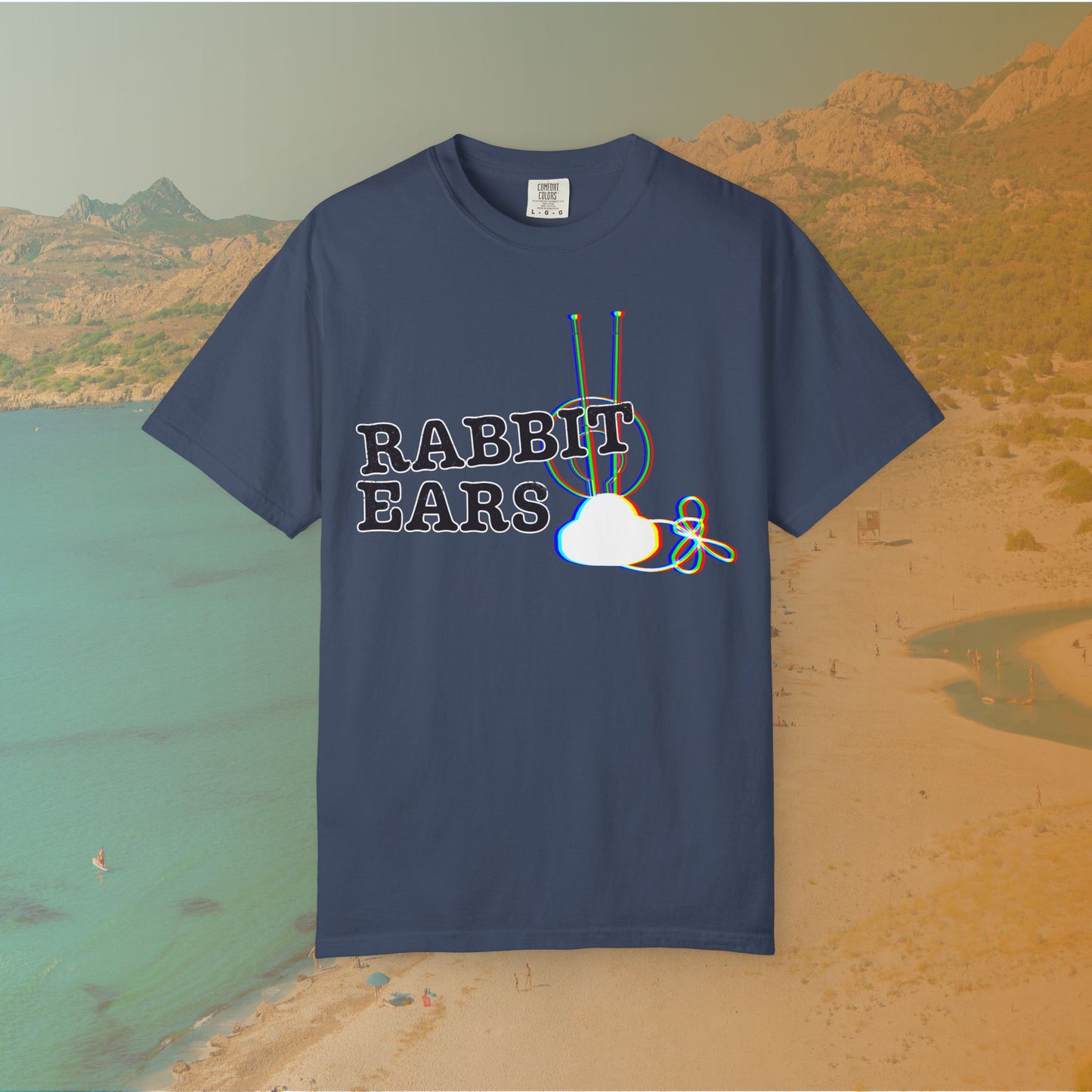 navy blue t-shirt distressed EDM music festival text "RABBIT EARS" next to a graphic of a vintage TV antenna and cloud shape with a red, green, and blue (RGB) chromatic aberration/glitch effect, with an RGB shift design