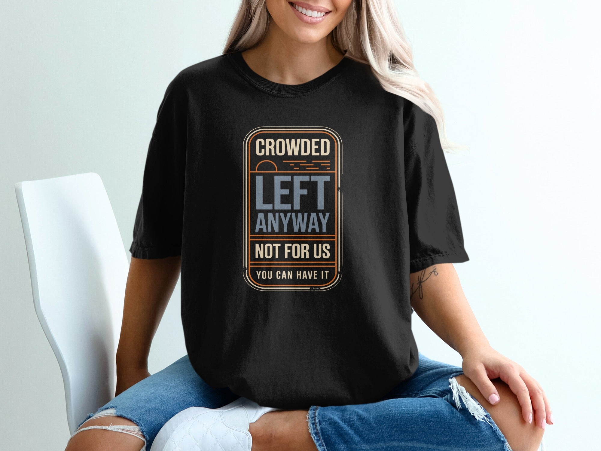 Black t-shirt with "CROWDED LEFT ANYWAY NOT FOR US YOU CAN HAVE IT" text.