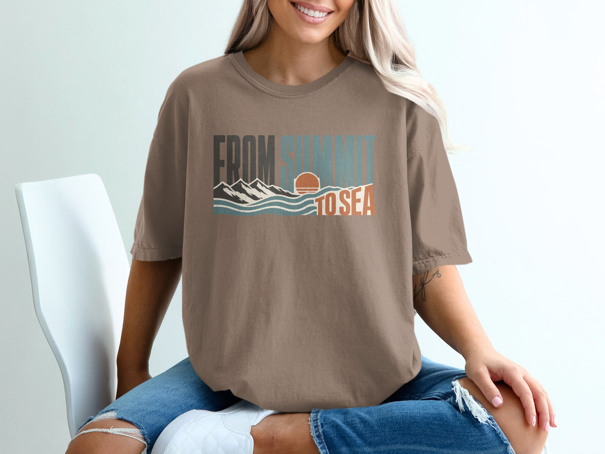 Brown t-shirt with "FROM SUMMIT TO SEA" graphic featuring mountains, waves, and sunset.