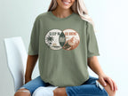 T-shirt graphic with Venn diagram: "Sleep In" (beach scene) and "Go Hiking" (mountain scene).