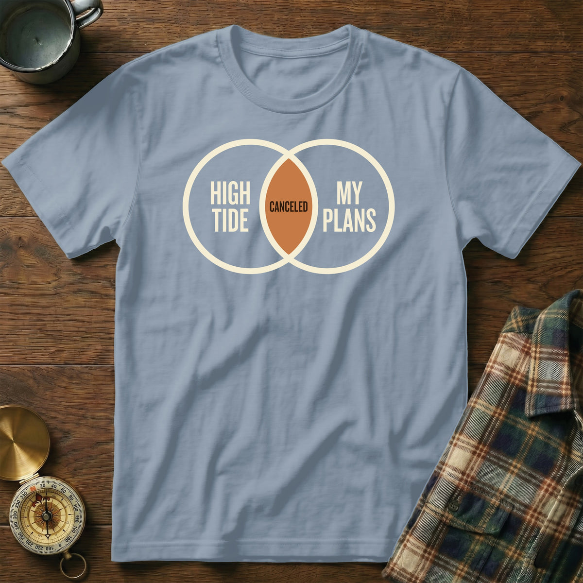 Blue t-shirt with Venn diagram graphic reading "HIGH TIDE" and "MY PLANS" with "CANCELED" in the overlap.