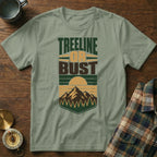 Light green t-shirt with "Treeline or Bust" text and mountain landscape graphic.