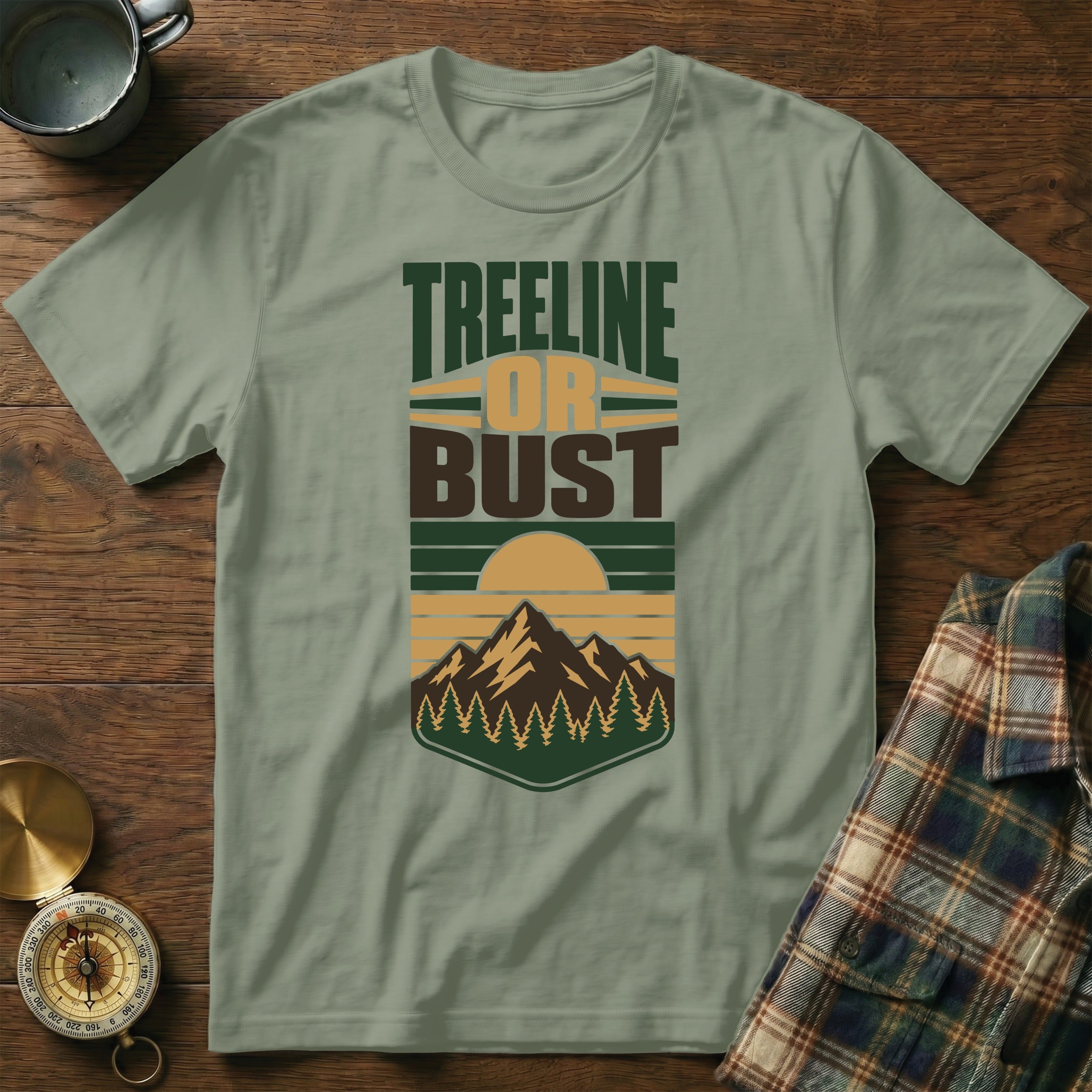 Light green t-shirt with "Treeline or Bust" text and mountain landscape graphic.