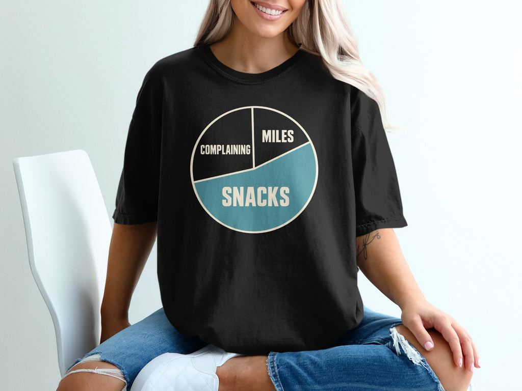 Black t-shirt with a pie chart graphic labeled "Complaining," "Miles," and "Snacks."