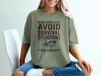 Olive green t-shirt with "Outdoor Survival Tip #4: Avoid Survival Situations" text.