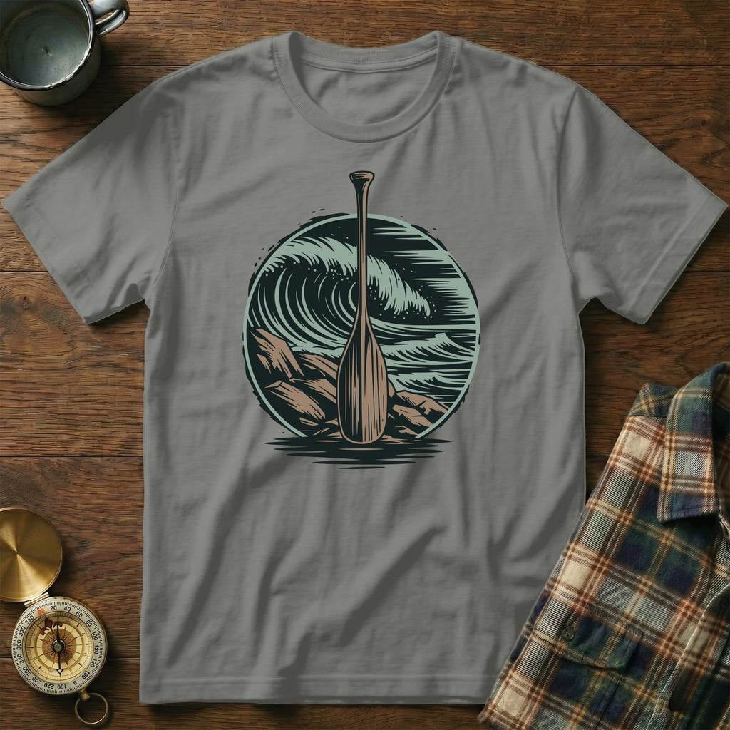 Paddle and crashing waves graphic on gray t-shirt.