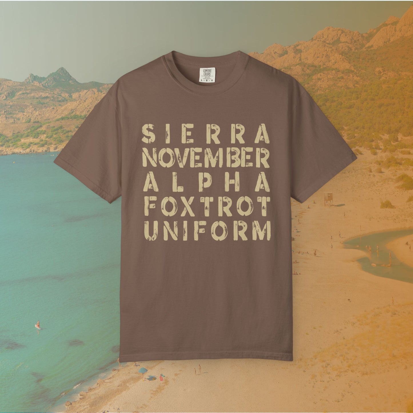 brown t-shirt Graphic T-shirt featuring the NATO phonetic alphabet words "SIERRA NOVEMBER ALPHA FOXTROT UNIFORM" in a large, distressed stencil font.