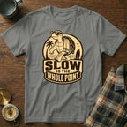 Gray t-shirt with a graphic of a turtle walking with sunglasses and a towel, saying "SLOW IS THE WHOLE POINT".