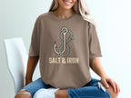 Brown t-shirt with anchor and rope graphic, text "SALT & IRON".