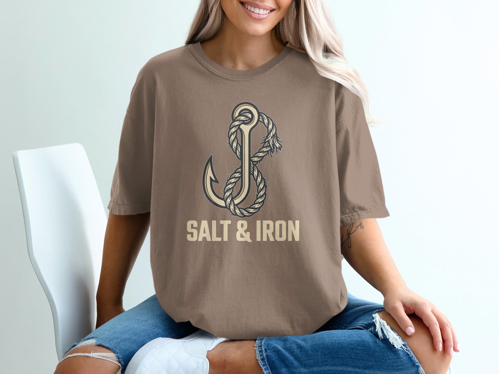 Brown t-shirt with anchor and rope graphic, text "SALT & IRON".