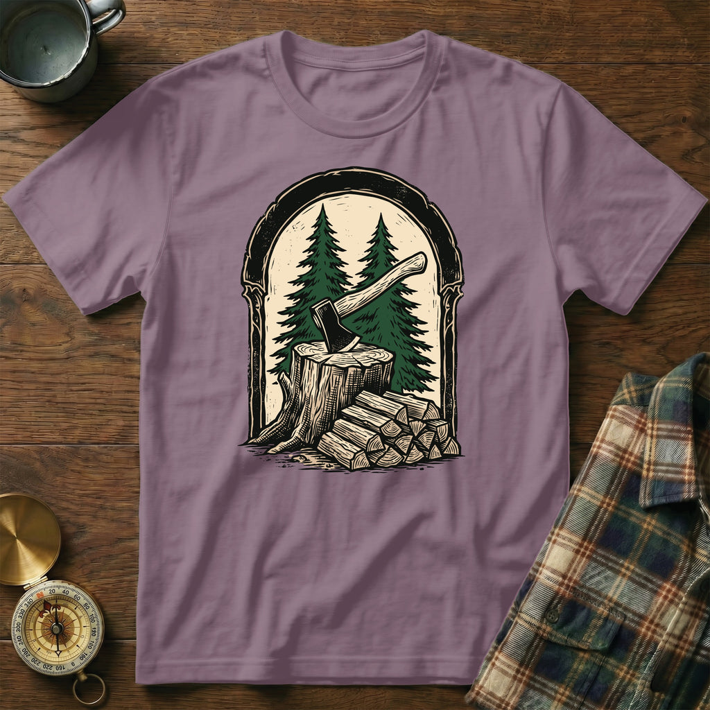 Axe and chopped wood in a forest scene, on a purple t-shirt.
