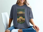 T-shirt with "Treeline or Bust" text and mountain landscape graphic.