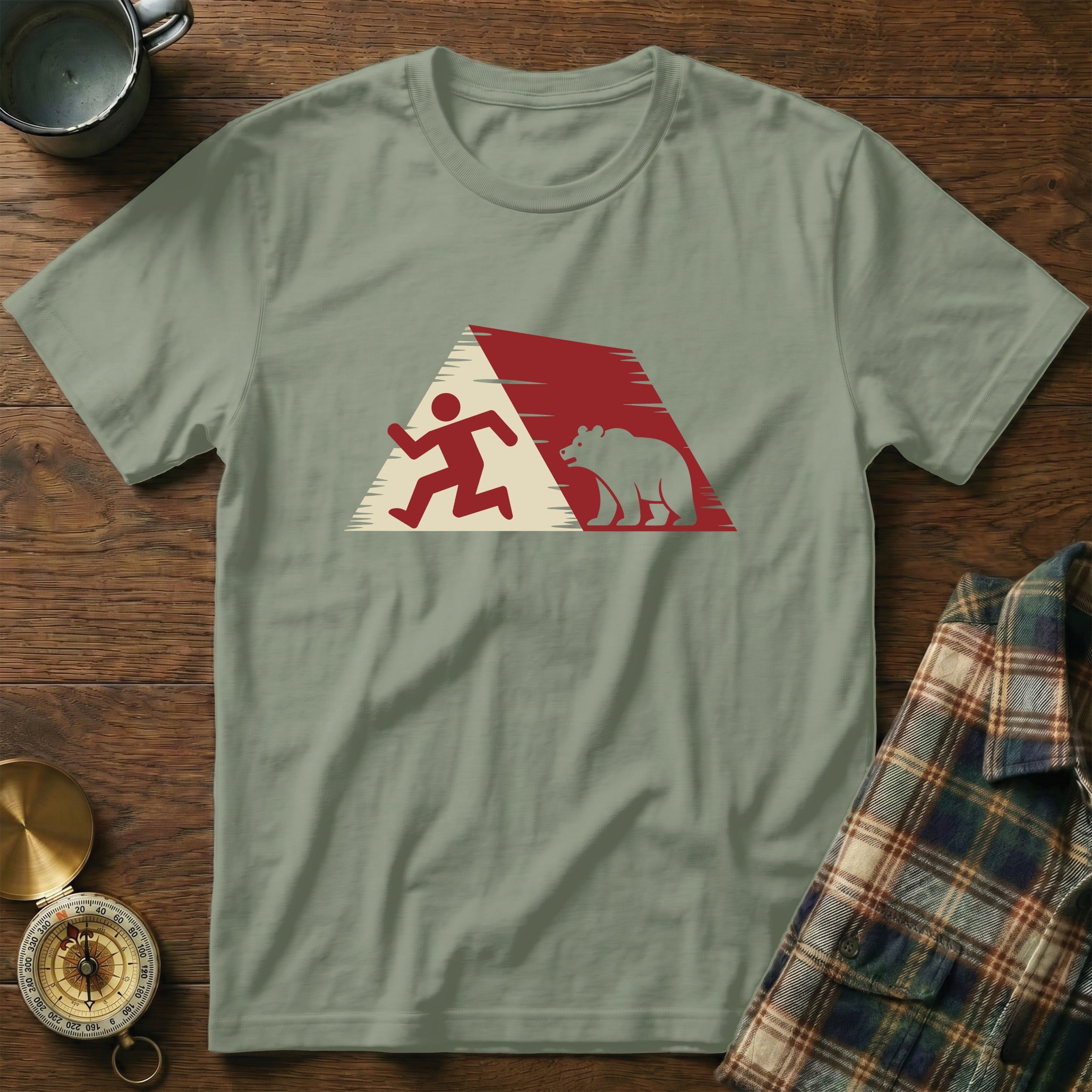 Running person and bear silhouette graphic on a green t-shirt.