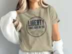 T-shirt with "LIBERTY LOOKS GOOD ON YOU" and mountains graphic.