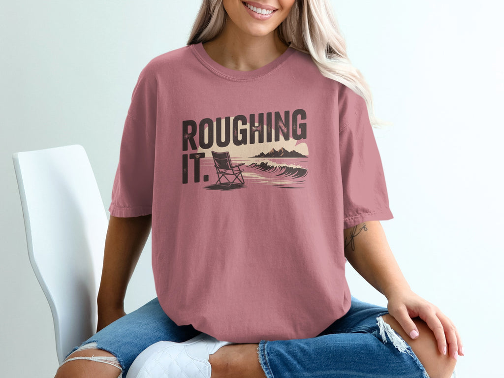 Comfort Colors graphic t-shirt with "Roughing It" text and beach scene.