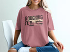 Comfort Colors graphic t-shirt with "Roughing It" text and beach scene.