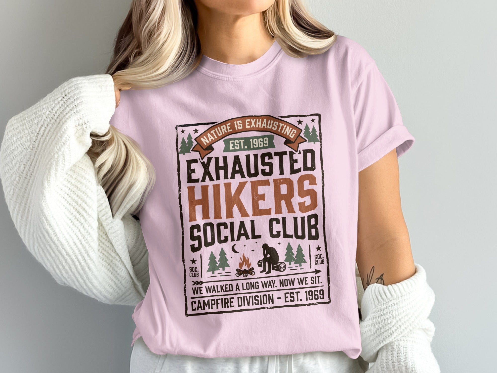 Pink t-shirt with "Exhausted Hikers Social Club" and campfire graphic.