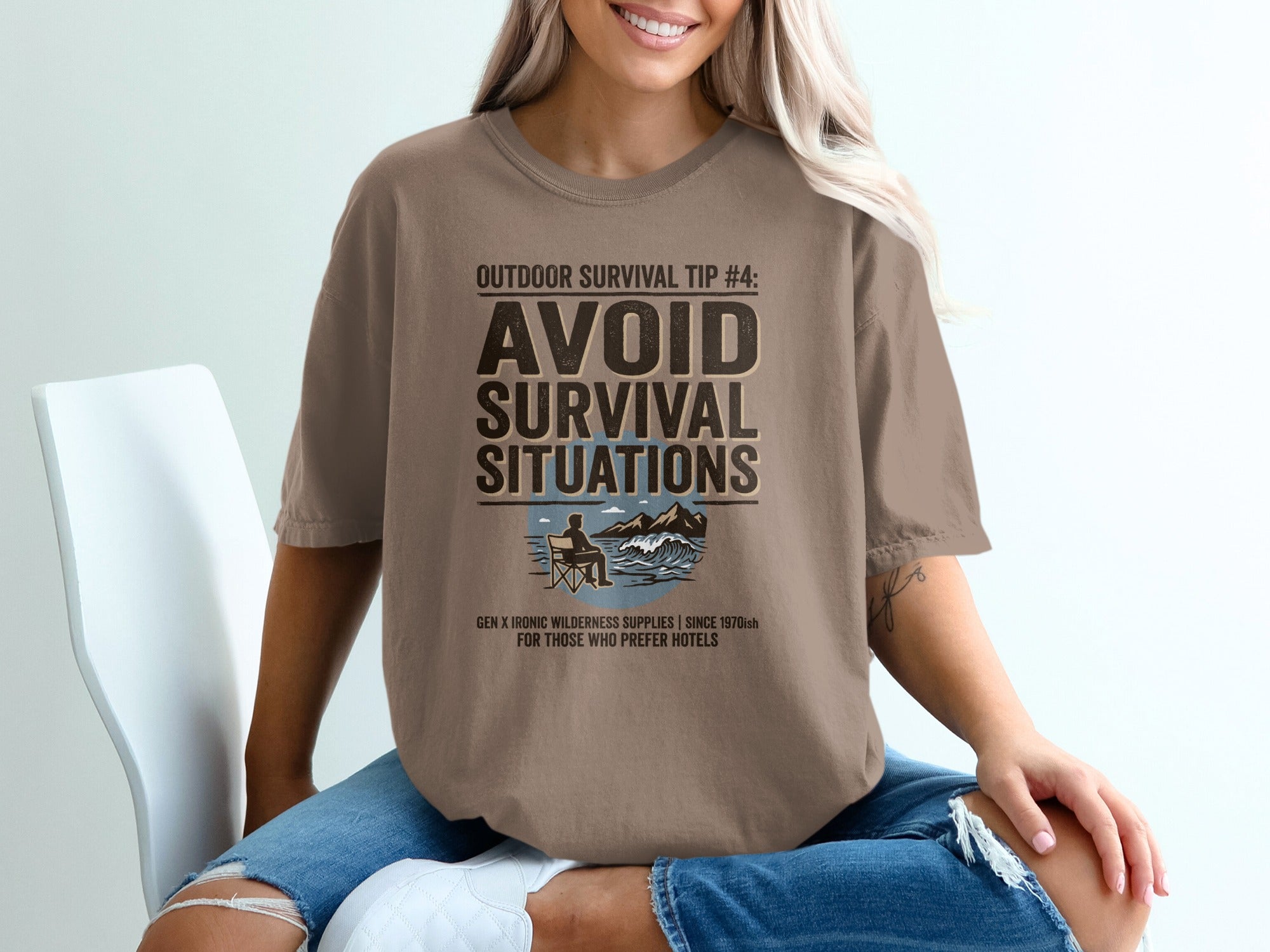 Brown t-shirt with "Outdoor Survival Tip #4: Avoid Survival Situations" design.