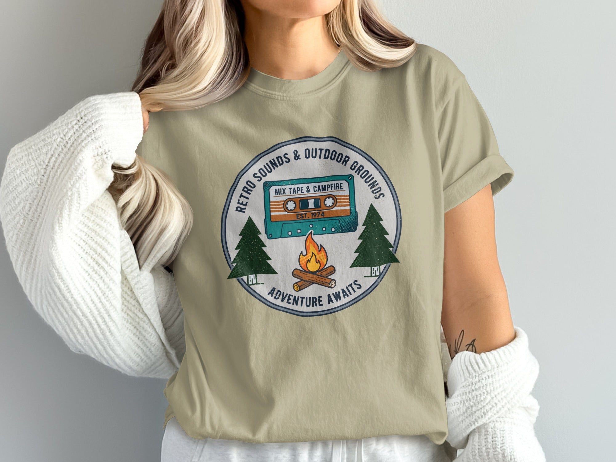T-shirt graphic featuring a cassette tape labeled "Mix Tape & Campfire" and "Adventure Awaits".