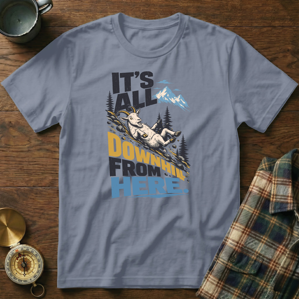 A gray t-shirt with a graphic of a goat sliding down a mountain and text reading It's All Downhill From Here.