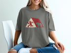 T-shirt featuring a stylized graphic of a runner and a bear within a red and white geometric design.