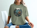 Graphic t-shirt with a circular oceanic scene and starfish.