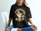 Black t-shirt with funny pelican graphic holding fish, text "Low Effort, High Reward".