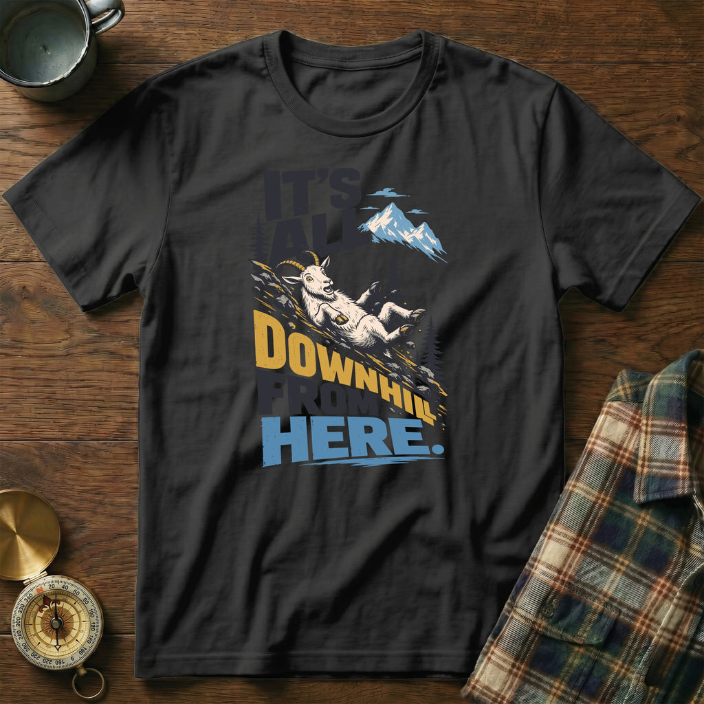 A black t-shirt features a graphic of a goat sliding down a mountain with the text It's All Downhill From Here.