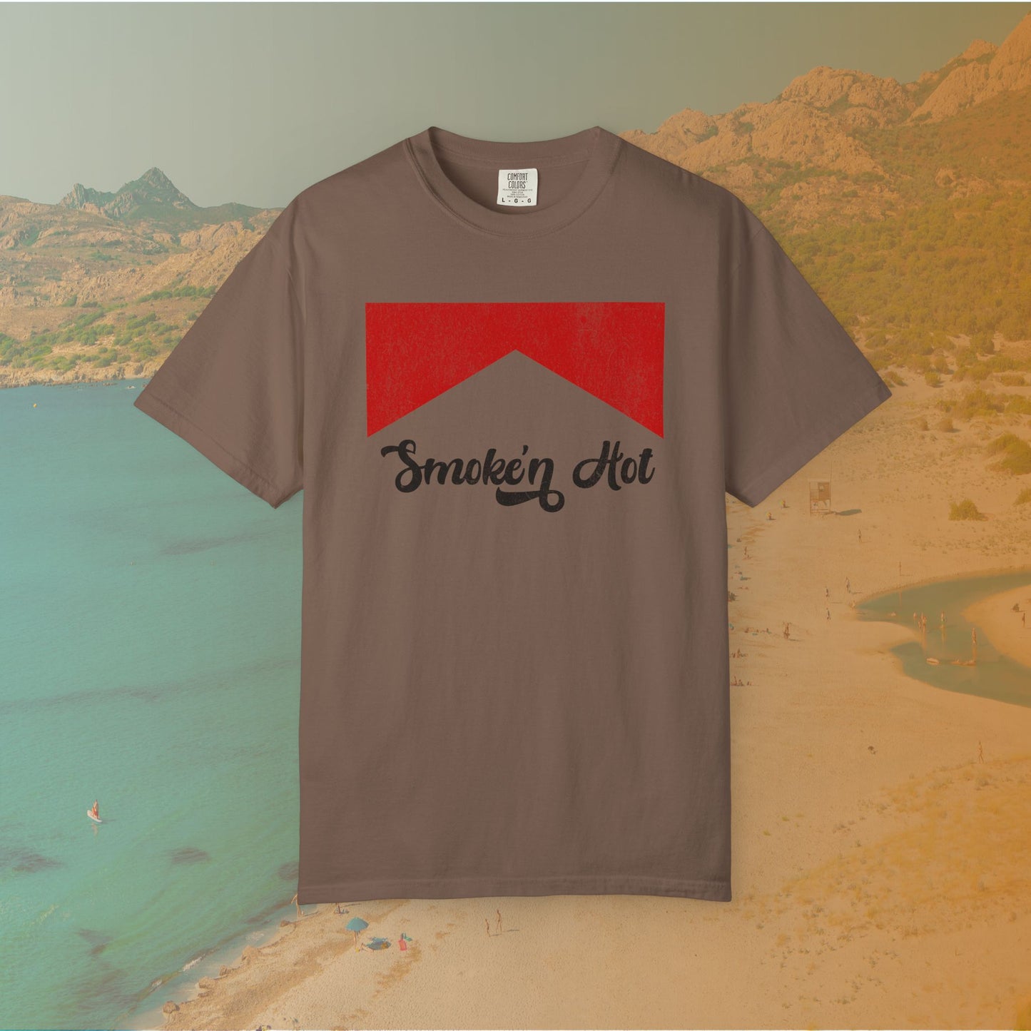 brown Graphic T-shirt featuring a distressed red chevron shape with the black script text "Smokin' Hot" centered below it, in a vintage style.