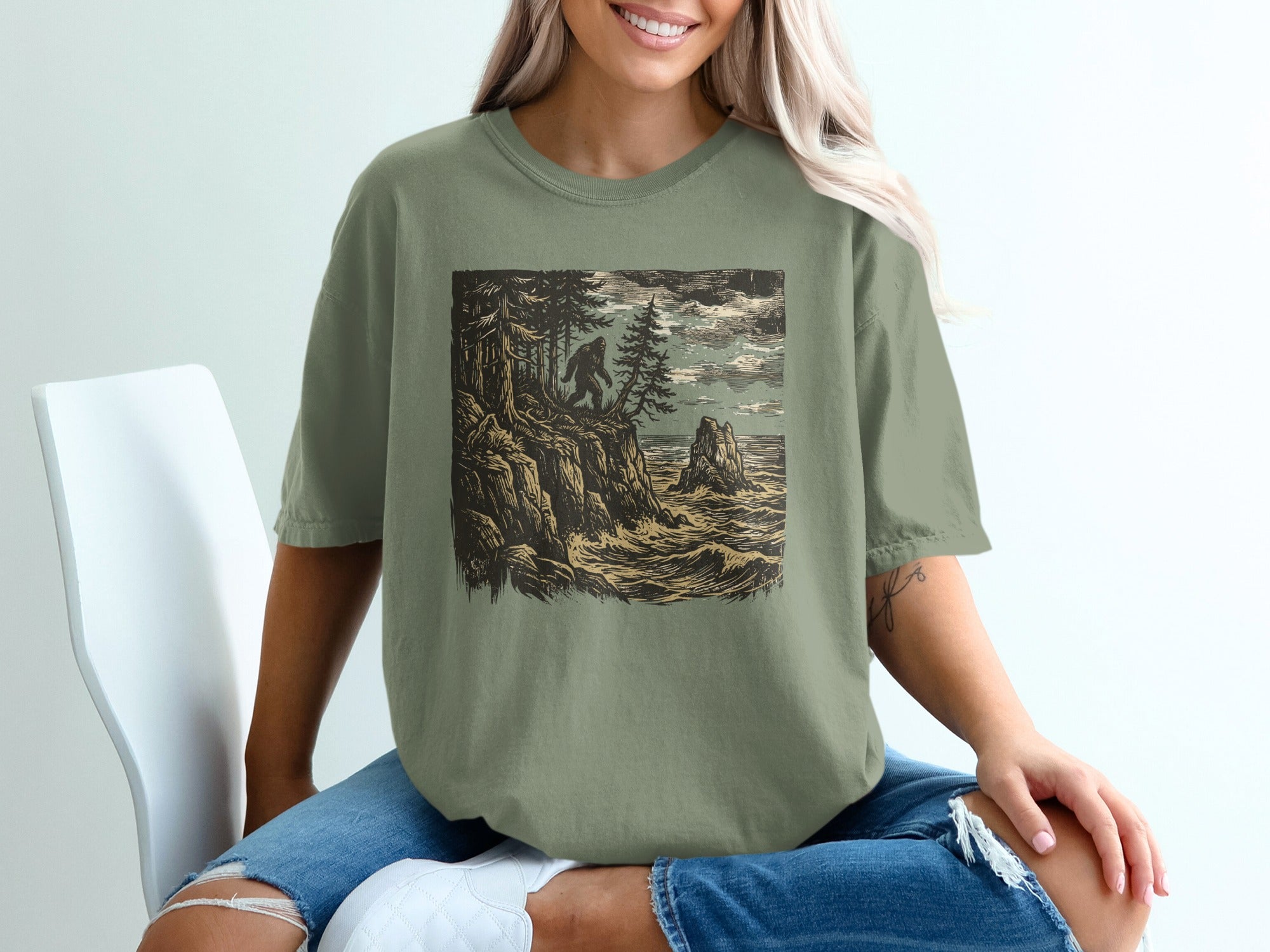 Illustration of Bigfoot on a cliff overlooking stormy ocean waves.