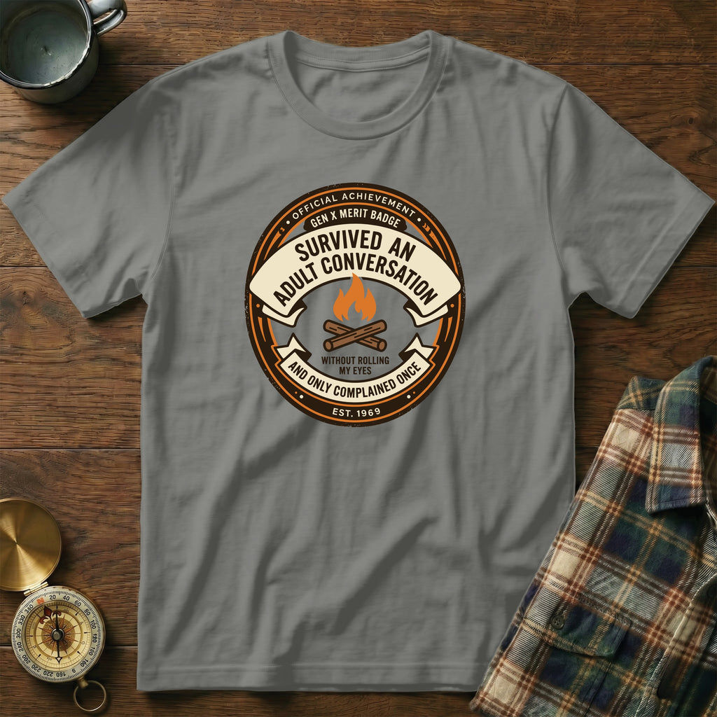 Gray t-shirt with "Survived an Adult Conversation" badge design.