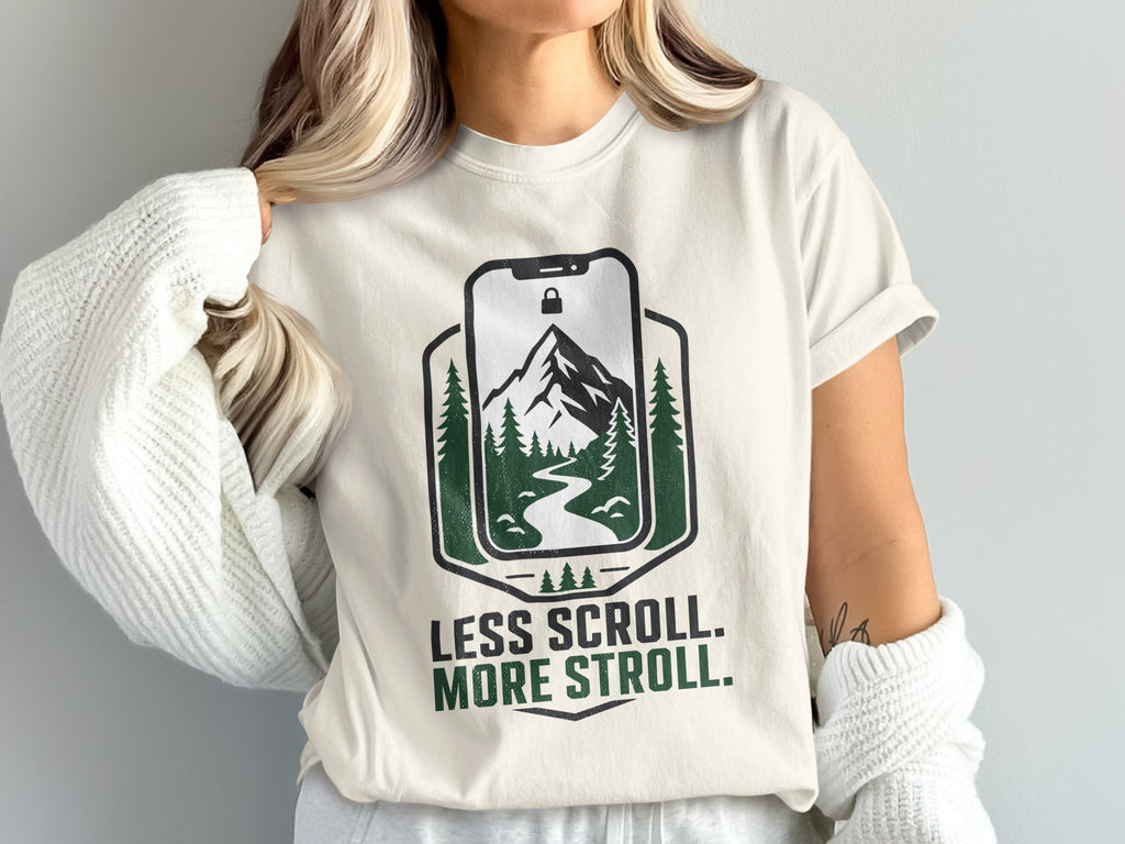 Cream t-shirt with nature graphic and text "Less Scroll. More Stroll."