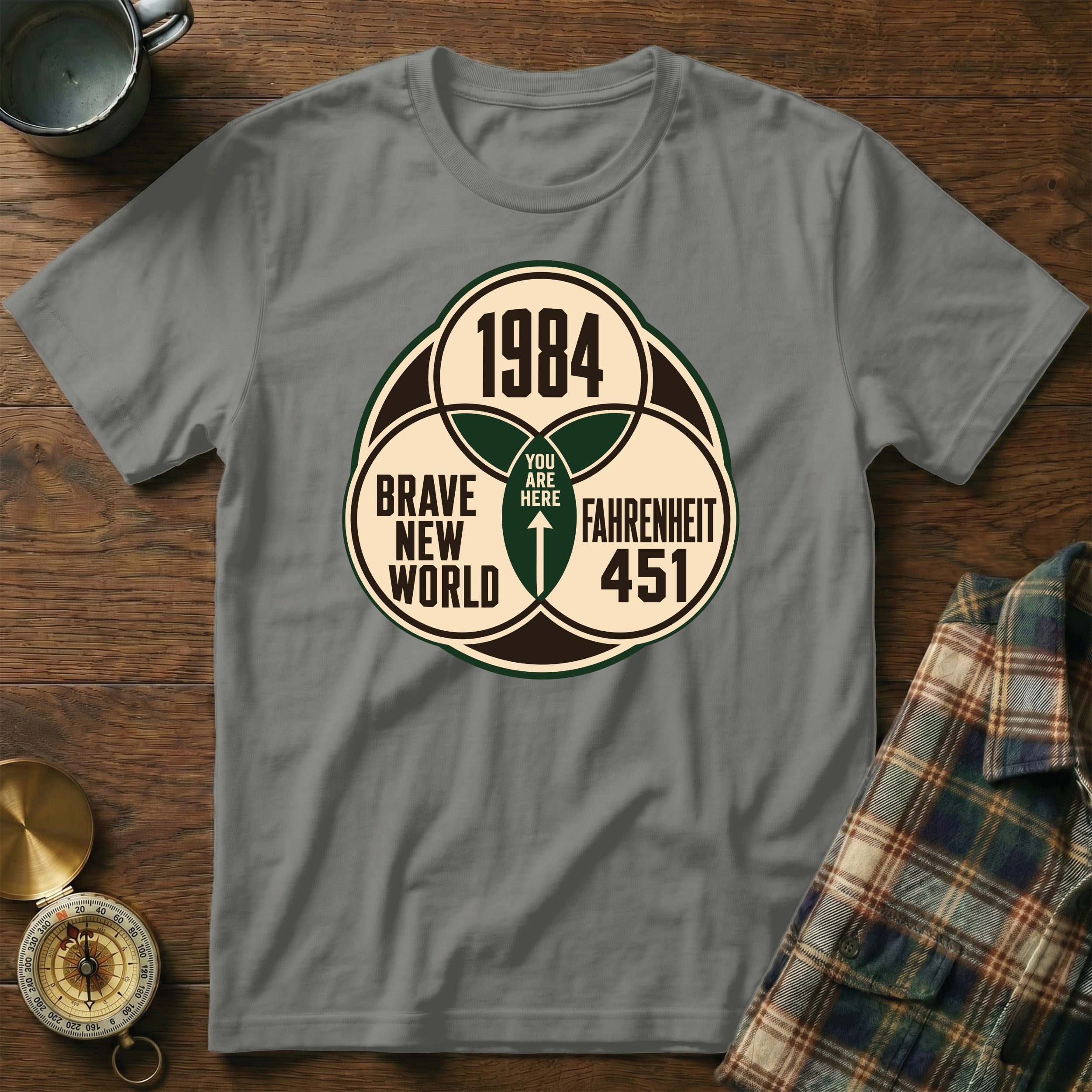 Grey t-shirt with a graphic of 1984, Brave New World, and Fahrenheit 451.