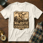 White t-shirt with graphic of a deer blowing a horn, text reads "MAJESTIC BUT EXHAUSTED".