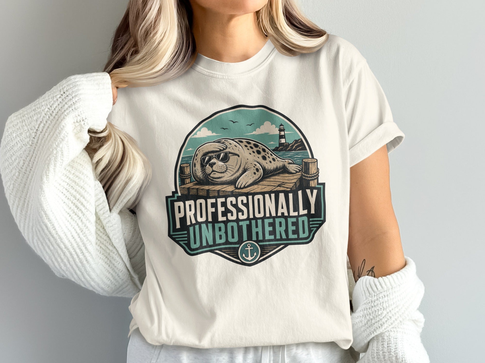 Seal wearing sunglasses on dock with text "Professionally Unbothered"
