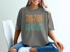 Gray t-shirt with orange and teal text reading "The tide went out so did my patience."