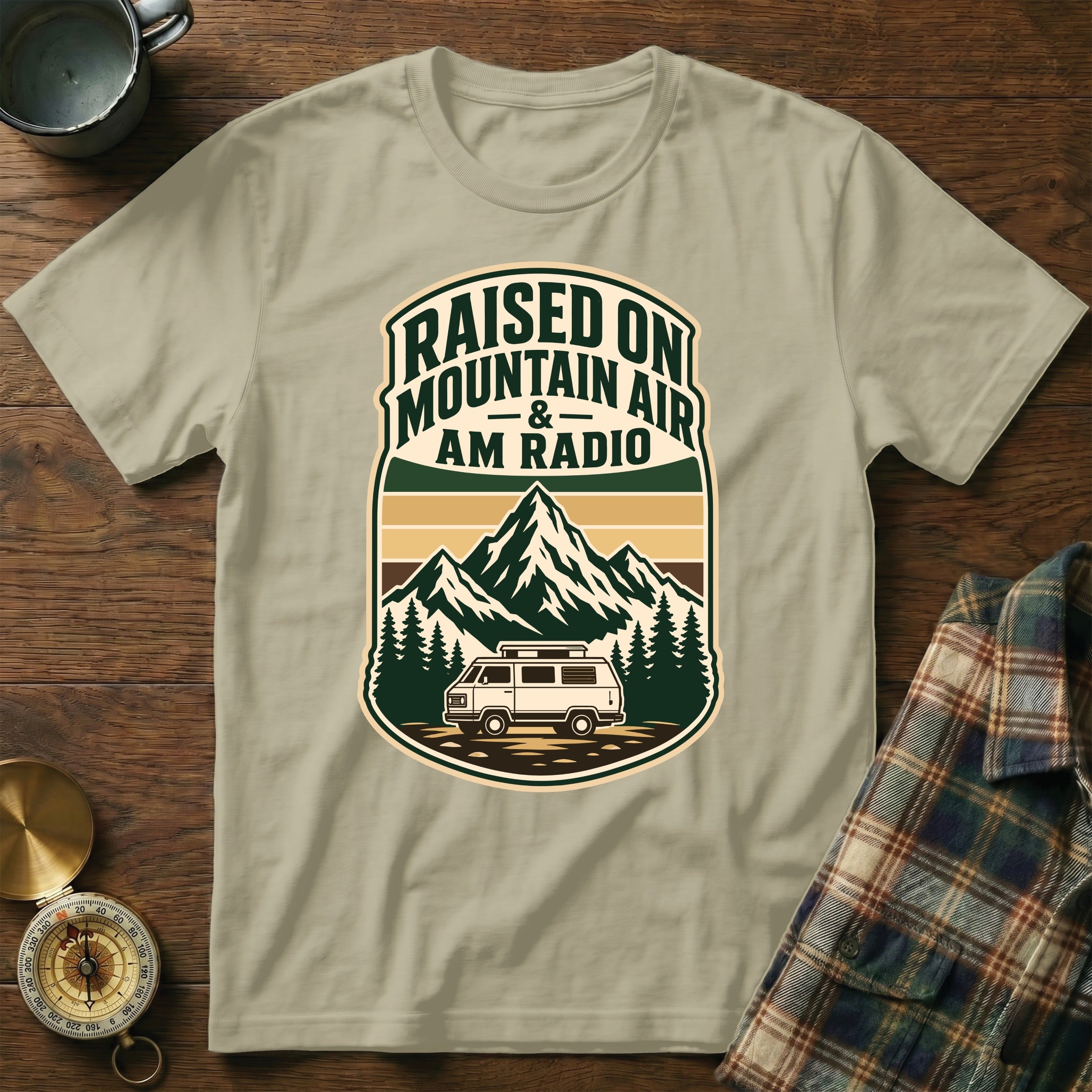 T-shirt with vintage crest: "Raised on Mountain Air & Am Radio" and camper van.