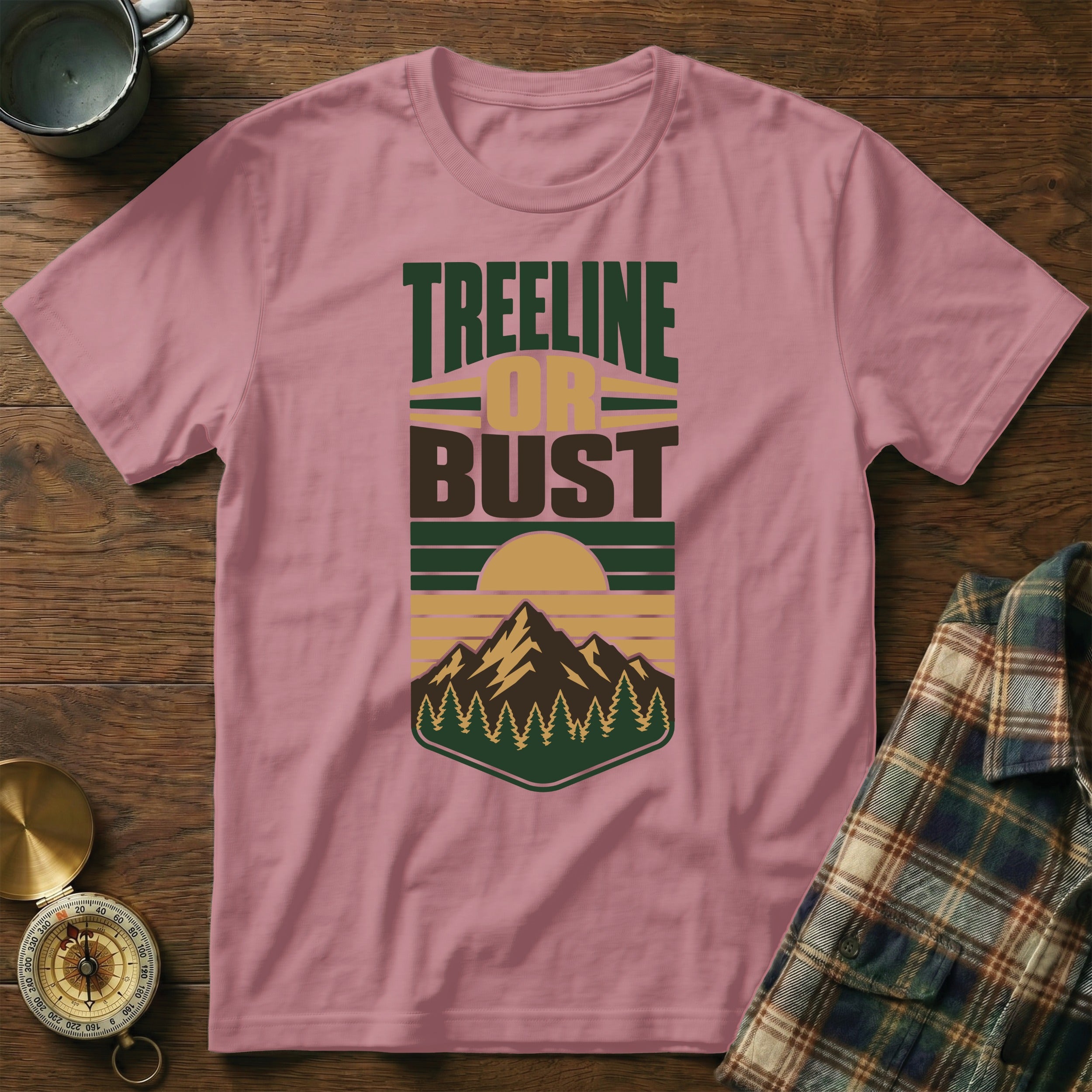 Pink t-shirt with "TREELINE OR BUST" text and mountain graphic.