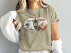 T-shirt graphic with Venn diagram showing "Sleep In" and "Go Hiking" with "Regret" in the overlap.
