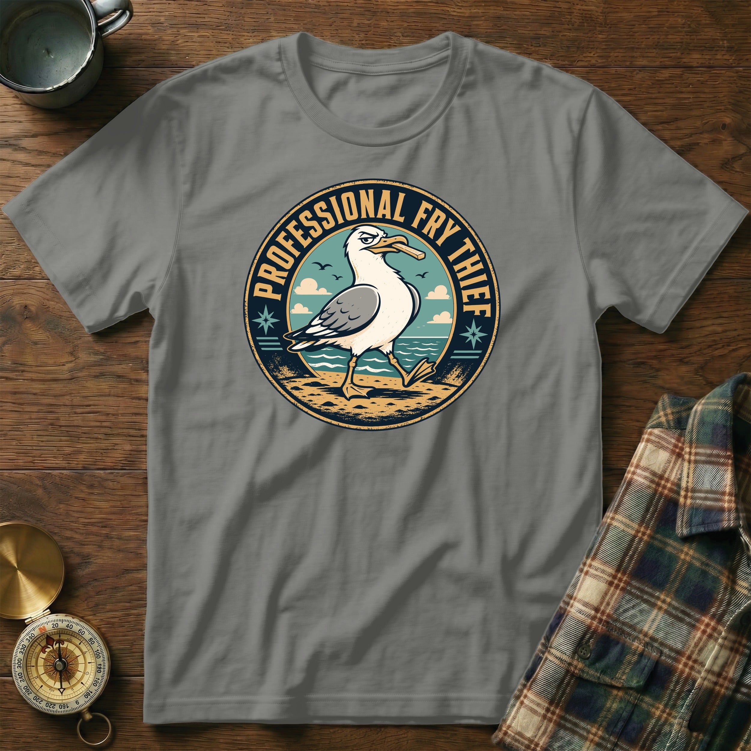 Seagull on beach wearing hat with text "PROFESSIONAL FRY THIEF"