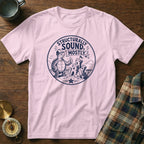 Pink t-shirt with a graphic of a turtle giving a thumbs up next to a sandcastle.