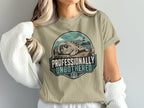 T-shirt design with a seal wearing sunglasses on a dock, text "PROFESSIONALLY UNBOTHERED".