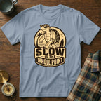 Light blue t-shirt with cartoon turtle graphic and "SLOW IS THE WHOLE POINT" text.