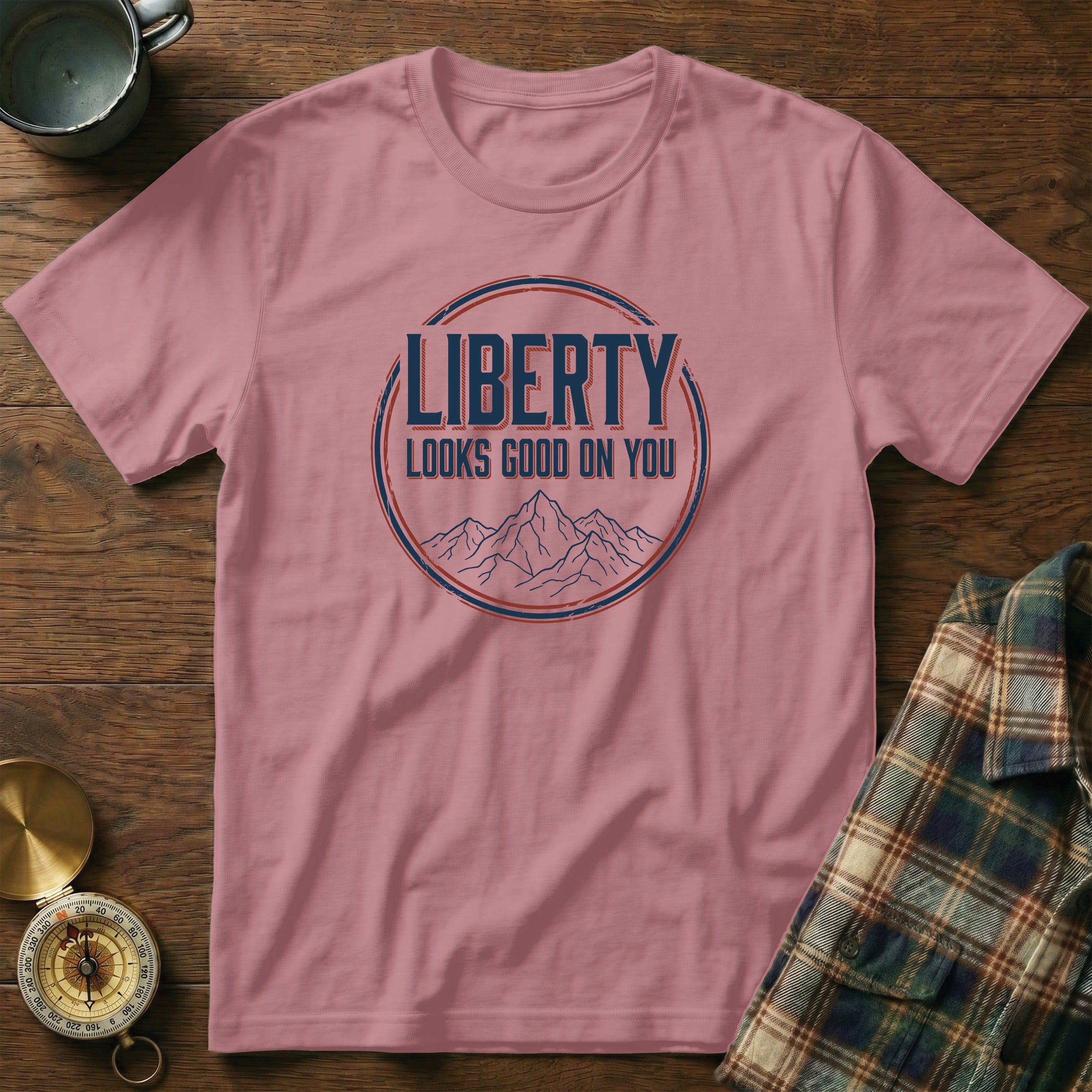 Rose t-shirt with "LIBERTY LOOKS GOOD ON YOU" text and mountain graphic.