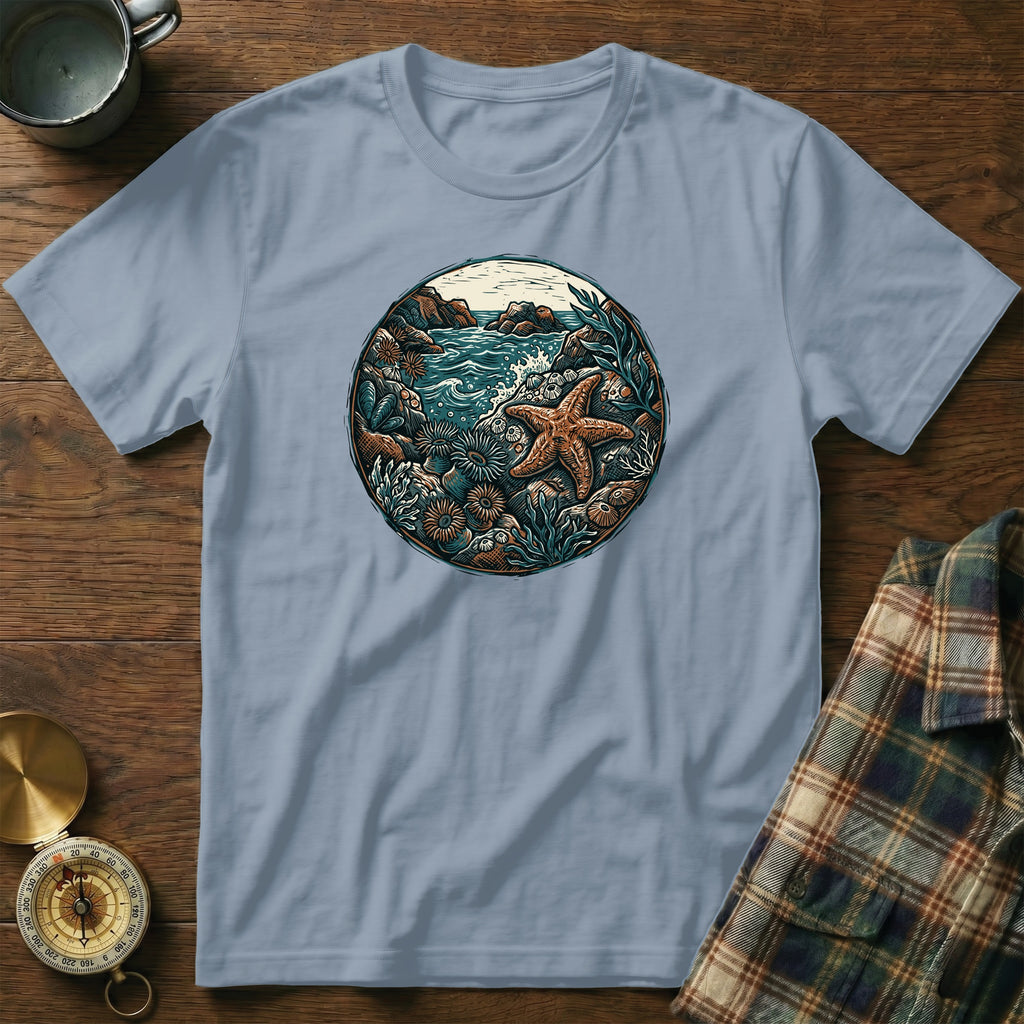 Light blue t-shirt with circular marine life graphic featuring a starfish and ocean.